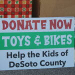 Realtors, Rotary give toys, bikes, for Christmas