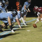 Friday sports: Bears claw Trojans in football playoffs