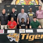 Tiger football trio signs college commitments