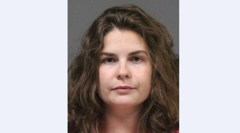 Woman charged with fondling minor