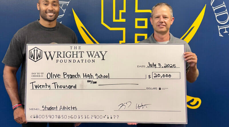 KJ Wright distributes proceeds from Charity Alumni Basketball Game