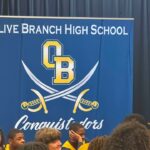 Olive Branch police attend second annual Donuts With Dads event with high school football team Photos from Olive Branch Police Department's post