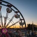 Ribbon-Cutting and Ride Drop to Kick Off Mid-South Fair on Oct. 1 Rides and fairgoers at a county fair at sunset. (Photo: Pexels)