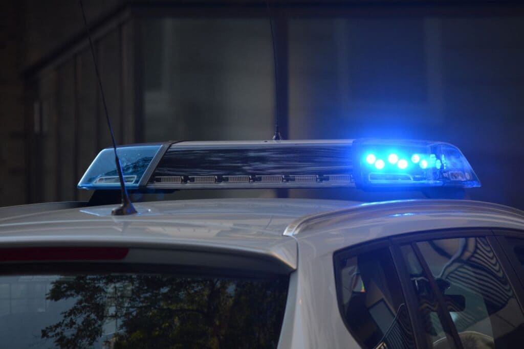 Flashing blue police lights illustrating the Southaven bank robbery arrest