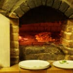 The 5 Best Outdoor Pizza Ovens for DeSoto County Family Nights Wood-fired outdoor pizza oven with flames inside