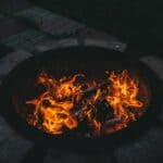 The 5 Best Backyard Fire Pits for DeSoto County Families A backyard fire pit with bright flames glowing at night