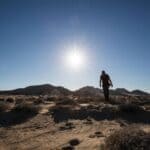 DeSoto County Record Heat: Memphis Hits 93 Degrees A bright midday sun in a clear blue sky above a dry landscape, illustrating DeSoto County record heat