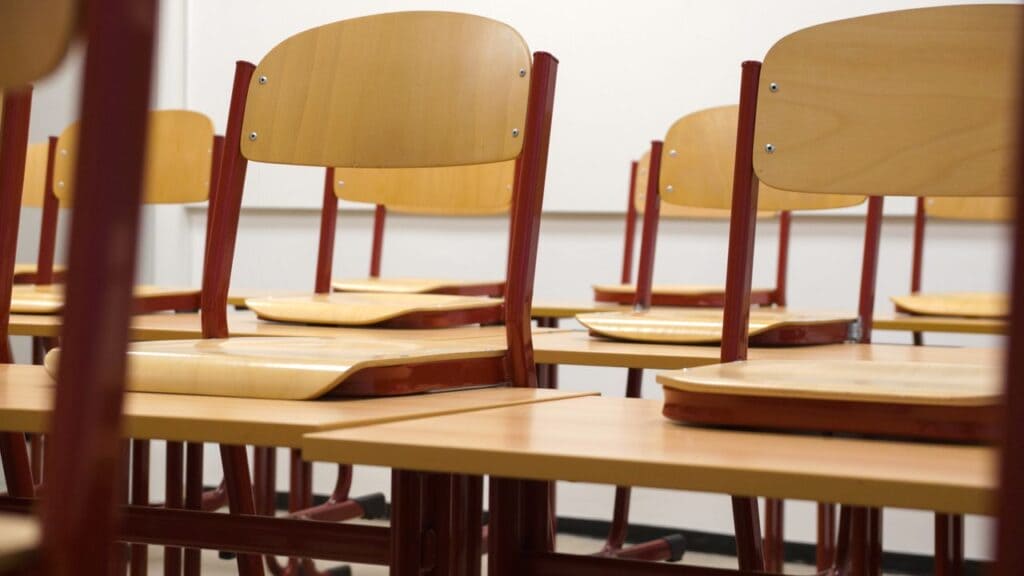 Empty classroom with wooden desks and chairs, illustrating DeSoto County school grades for 2026