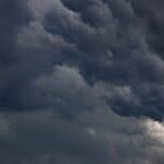 DeSoto County Weather: Ozone Alert Today, Isaias Rain Saturday Dark storm clouds filling the sky, illustrating DeSoto County weather as Isaias remnants approach