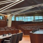 DeSoto Supervisors to Weigh Rubbish Pit Fire, Cashless Plan Empty government conference room with wooden desks, illustrating the DeSoto County Board of Supervisors meeting