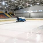 Landers Center Ice Installed for Monarchs Home Opener Ice resurfacer smoothing an indoor rink, similar to the new Landers Center ice in Southaven