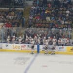 Mid-South Monarchs Win First Game in Franchise History Minor league hockey players celebrate a goal, illustrating the Mid-South Monarchs first win