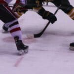 Mid-South Monarchs Hockey Debuts Tonight; Home Opener Oct. 23 Hockey players at a faceoff, illustrating the Mid-South Monarchs season opener