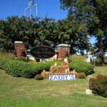 Things to Do in DeSoto County This Weekend: Oct. 16-18 City of Hernando welcome sign decorated with hay bales, pumpkins and a scarecrow, a fall scene for things to do in DeSoto County this weekend